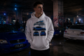 P25 Legacy Hoodie in White — male lifestyle, underground car park | MotorHedz